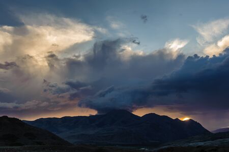 Scenic sunset and sunrise in mountainous region of Altai