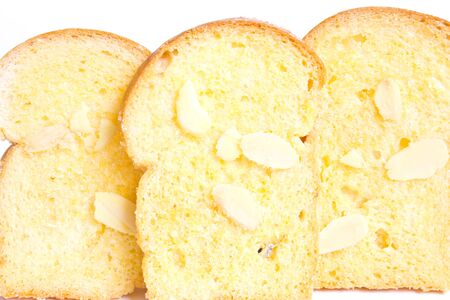 Row of baked butter toast with sliced almonds
