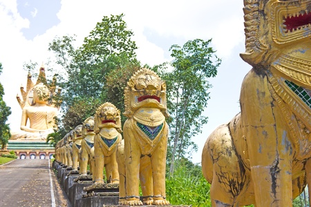 Row of golden lion guard thai temple, Wat BangRiang, thailandの写真素材