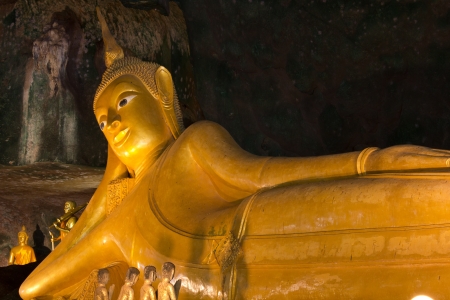 Statue of Reclining Buddha in Buddhist temple at Suwankuha temple, Phang Nga-Phuket , Thailandのeditorial素材