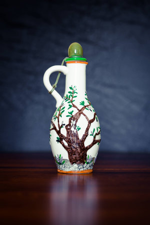 earthen vessel on a dark brown wooden tableの写真素材