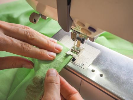 Sewing process close-up on the sewing machine.
