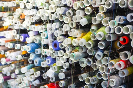 Background of the spools of colored thread