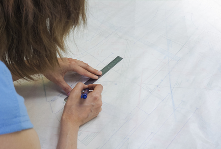 Drawing schemes on tracing paper. Tailor's business