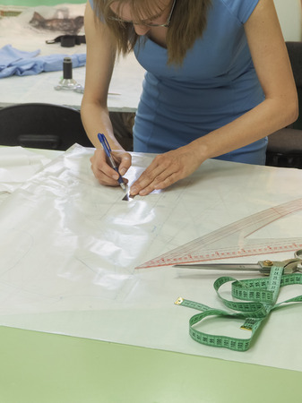 Drawing schemes on tracing paper. Tailor's business