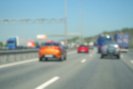 Blur traffic road with bokeh light abstract backgroundの写真素材