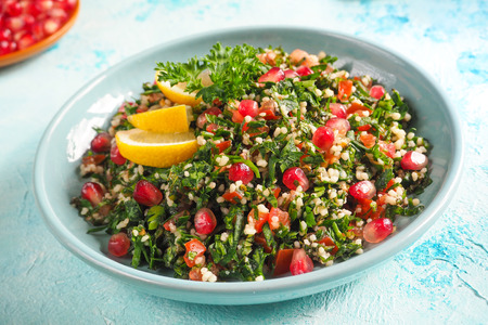 A plate of tabbouleh salad, close-up. Traditional Arabic foodの写真素材