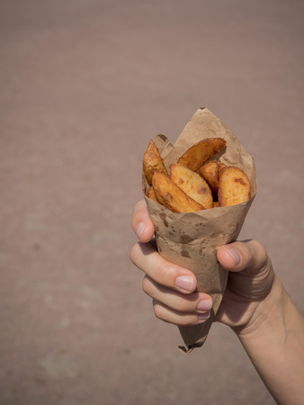 Small pack of potato fries, fast snack in the streetの写真素材