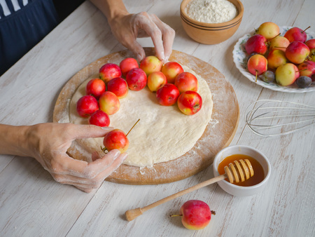 Sponge apple cake "Sharlotka" with baking ingredients, rustic style. Apple Ranet pie bakingの写真素材