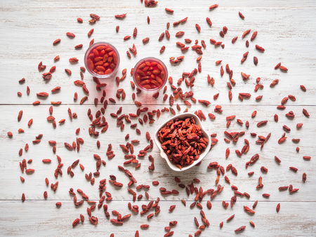 Jelly slimming Goji berries on a white wooden table. The view from the topの写真素材