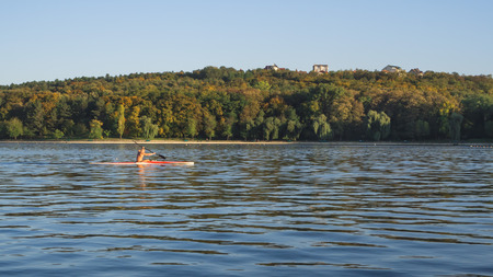 Rower on the lake. The concept of a healthy lifestyle