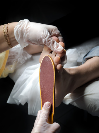 Cosmetic foot care. Process of pedicure at beauty salonの写真素材