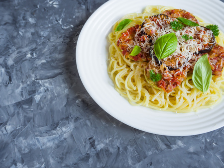 A plate of pasta and braised eggplant with Parmesan.の写真素材