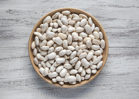 White beans in a plate on a light table