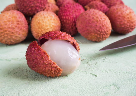 Ripe lychees on a green table. Top viewの写真素材