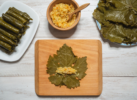 Stuffed Grape Leaves. Preparation of Dolma from grape leaves.