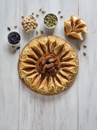 Arab sweets. Arabian pancake stuffed with sweet cheese and pistachios.の写真素材