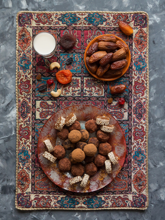 Arab sweets from dates. Healthy organic energy bites with dates - vegan vegetarian raw snack or meal.の写真素材
