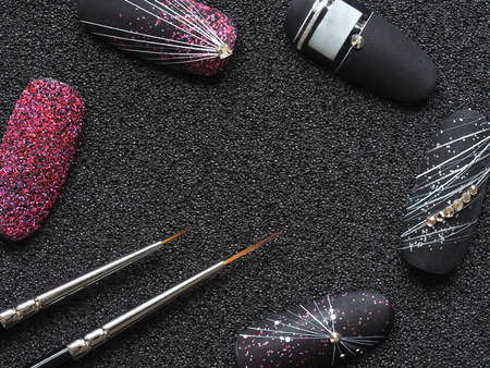 Thin brush to paint on the nails. Stylish design on tips.