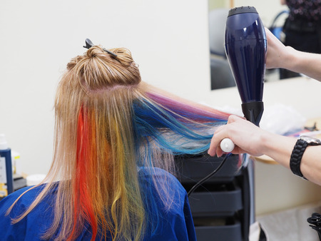 Hair dryer drying after coloring. Beauty conceptの写真素材