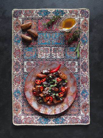 Lamb with figs in a sweet sauce. Asian cuisine. Top view.