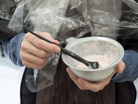 Hair coloring. Selection of color. Bowl for mixing the composition for coloring hair.