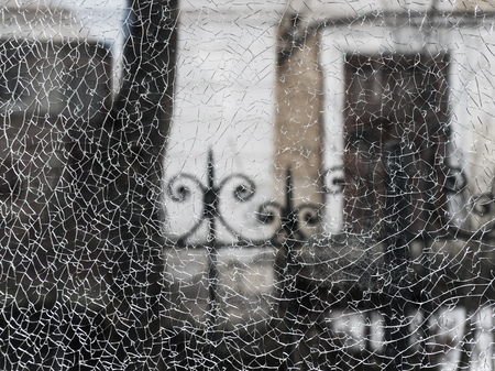Cracks in the window glass. Texture of broken glass.