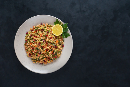 Ramadan food. Salad with couscous and pomegranate. Top view.の写真素材