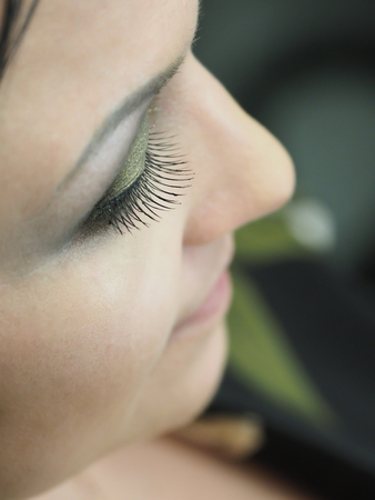 Eyelash extension. A woman eye with lashes.の写真素材