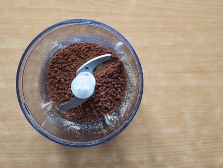 Food processor with knife blades taken from overhead perspective.