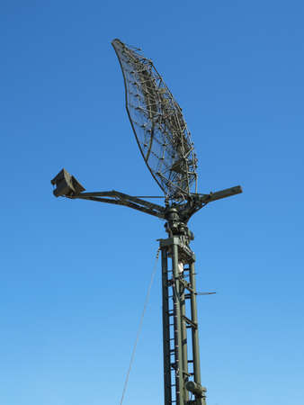 Military directional antenna on a blue sky background.の写真素材