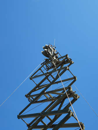 Military directional antenna on a blue sky background.