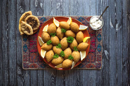 Arabic meat appetizer Kibbeh. Traditional Arabic kibbeh with lamb and pine nuts.