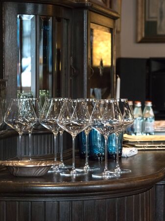 Empty wine glasses are served on the table.の写真素材