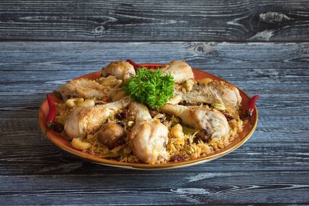 Chicken Arabic Kabsa on a dark wooden backgroundの写真素材