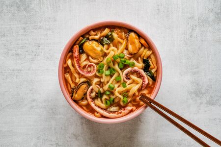 Delicious spicy seafood noodle soup. Top view, copy spaceの写真素材
