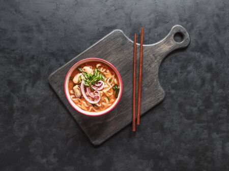Delicious spicy seafood noodle soup. Top view, copy spaceの写真素材
