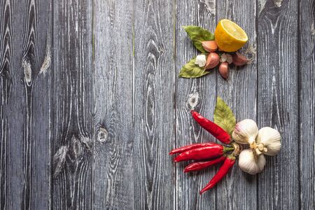Various products of red hot pepper are laid out on a black background.