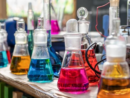 Test tubes with a colored reagents in a rack.の写真素材