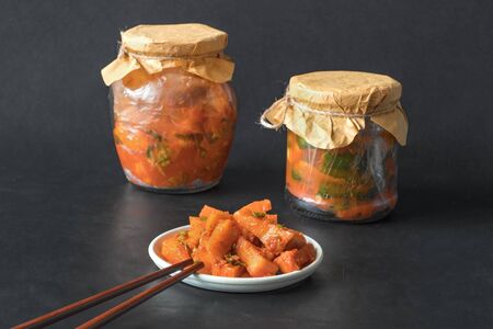 Korea kimchi pumpkin pickles on a black background.の写真素材
