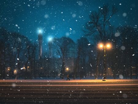 Snow storm in the night city. Beautiful night view with the mosque and the snowfall in...