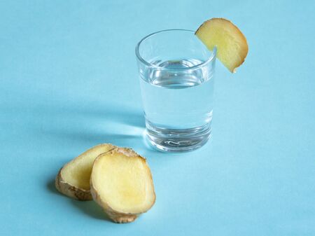 Antiviral tincture of alcohol with ginger root, strengthening of immunity concept, top view.の写真素材