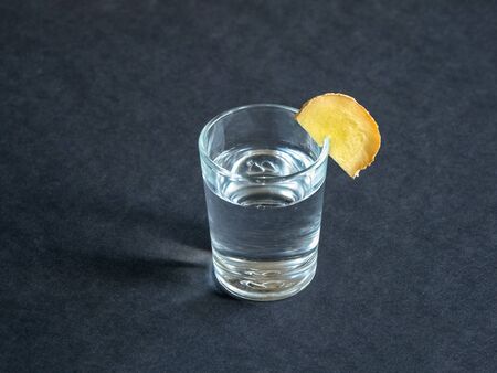 Antiviral tincture of alcohol with ginger root, strengthening of immunity concept, top view. の写真素材