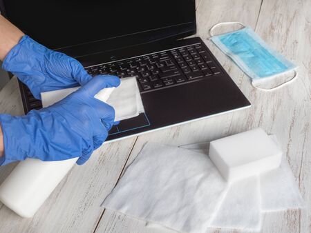 Laptop disinfection to protect yourself from bacteria and viruses, stay at home, work remotely.
