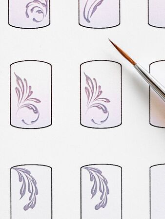 Training in painting monograms for manicure. Training cards for manicure, close up. の写真素材