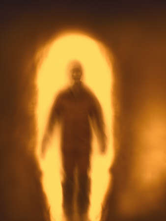 Blurred silhouette of man against fire portal.