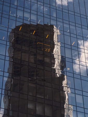 Abstract background with blurred reflections in mirrors. Abstract fragment of modern architecture, walls made of glass.の写真素材