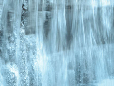 Blurred stream of water. Beautiful view of flowing water.の写真素材