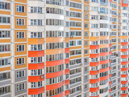 Fragment of a wall with windows of a multi-storey apartment building.の写真素材