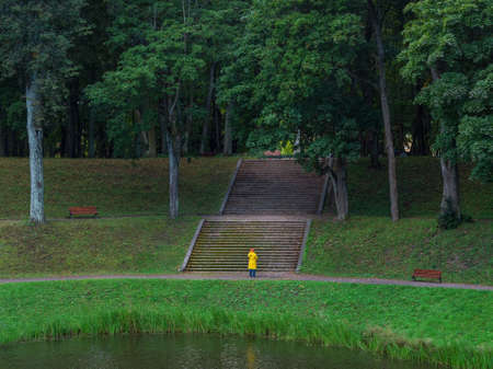 Old green Park with a wide stone staircase. Gatchina. Russia.